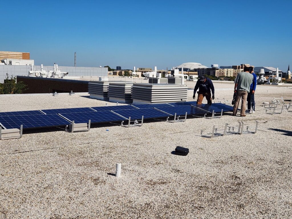 Installing the lab's rooftop solar array, October 2023